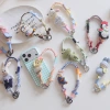 2026 Cute and playful hand-woven mobile phone lanyard, penguin rabbit animal lanyard, pendant, anti-loss wrist strap for girls details Picture